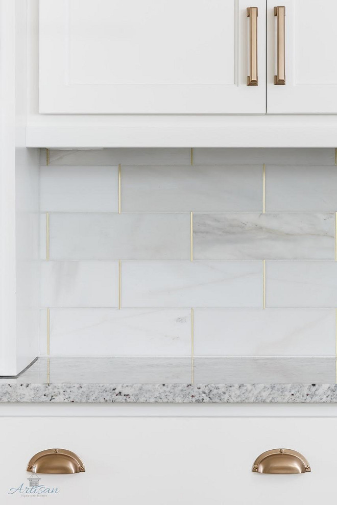 Kitchen Backsplash. Kitchen backsplash is honed marble by the Tile Shop with brass schluter strips. #KitchenBacksplash #Kitchen #Backsplash #honedmarbletile #TileShop #brassschluterstrips Built by Artisan Signature Homes. Interior Design by Gretchen Black from Greyhouse Design