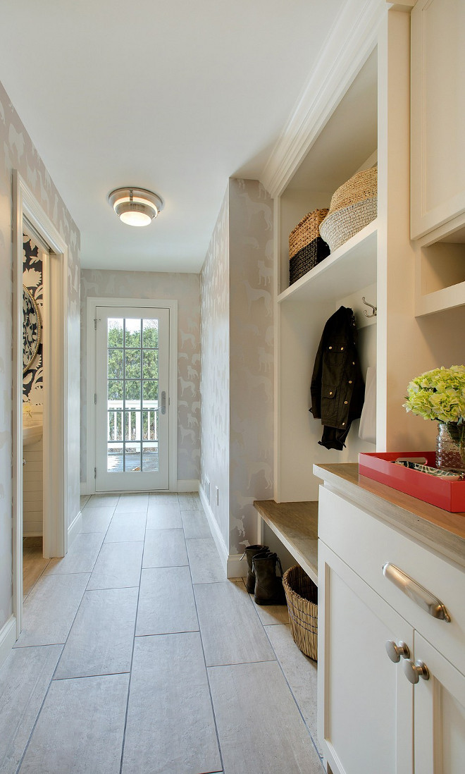 Mudroom neutral wallpaper. neutral mudroom wallpaper and tile. Wallpaper is Osborne & Little Wallpaper and floor tile is Refin: Wood2 Tile 12x24 DUST. Cabinet paint color is Sherwin Williams Alabaster. #mudroom #neutralmudroom #wallpaper Revision LLC