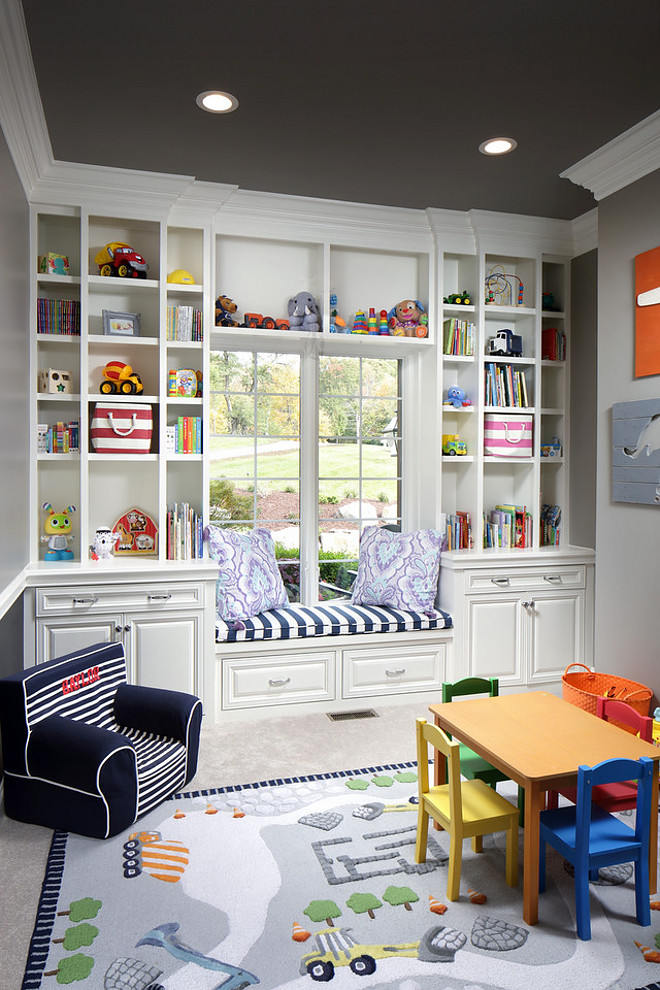 Playroom Cabinet and open shelves. This playroom features a custom cabinet with open shelves, drawers, doors and a window seat. Playroom Cabinet and open shelves. #PlayroomCabinet #Playroom #Cabinet #openshelves #storage Barrington Homes Inc.