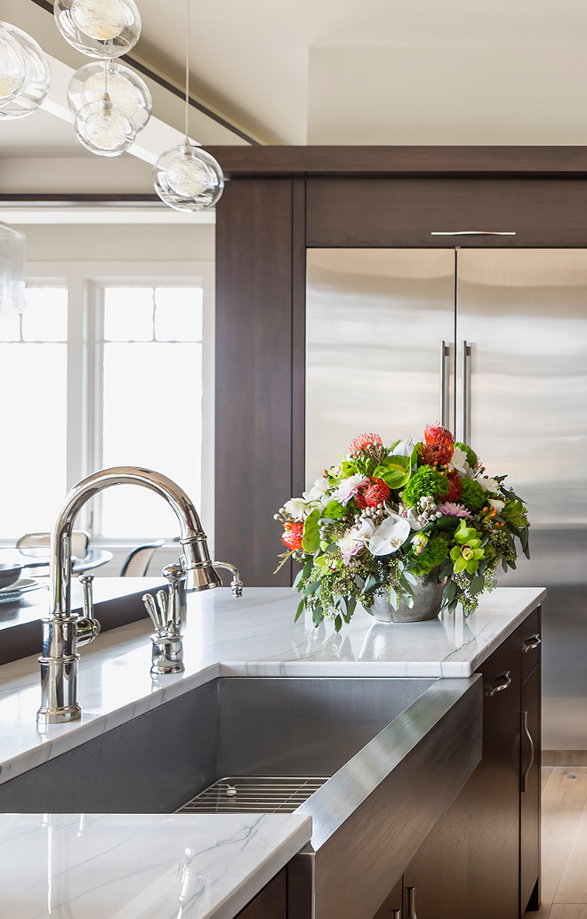 Polished Nickel Kitchen Faucet and Stainless Steel Farmhouse Sink. Polished Nickel Kitchen Faucet and Stainless Steel Farmhouse Sink Ideas #PolishedNickelKitchenFaucet #KitchenFaucet #StainlessSteelFarmhouseSink #FarmhouseSink Hendel Homes