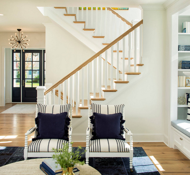 Spindle arm chair. Pair of Spindle arm chairs with striped fabric and navy pillows. The spindle arm chairs are from Lillian August with “Guiness” patterned fabric. Spindle arm chair #Spindlearmchair #Spindlechair #armchair Martha O'Hara Interiors. John Kraemer & Sons