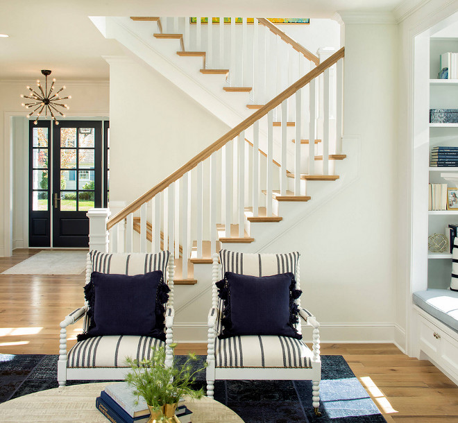 Spindle arm chair. Pair of Spindle arm chairs with striped fabric and navy pillows. The spindle arm chairs are from Lillian August with “Guiness” patterned fabric. Spindle arm chair #Spindlearmchair #Spindlechair #armchair Martha O'Hara Interiors. John Kraemer & Sons