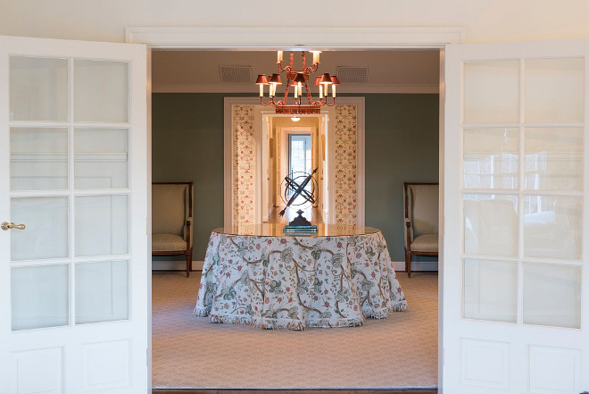 The cabinet is custom from John Rosselli, the table skirt is from Scalamandre with trim from Samuel & Sons, the chandelier is Niermann Weeks and carpet is Stark. Home Bunch's Beautiful Homes of Instagram @loveyourperch