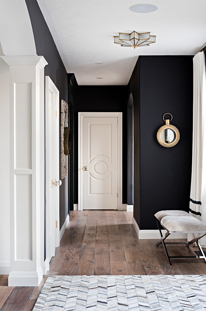 Benjamin Moore Onyx.. Black and white interiors. The black wall paint color is Benjamin Moore Onyx. Benjamin Moore Onyx The black wall paint color is Benjamin Moore Onyx. White trim paint color is Benjamin Moore Swiss Coffee #BenjaminMooreOnyx Sarah St. Amand Interior Design, Inc