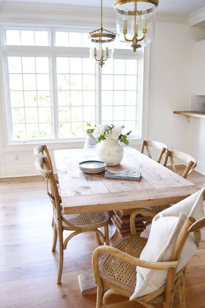 Breakfast Room. Breakfast area has a pair of Thomas O’Brien Merchant Pendants in Brass from Circa Lighting. Both the table and chairs are from Restoration Hardware. The table is the 60” Salvaged Wood Trestle Rectangular Table. Madeleine Chairs in Weathered Oak #breakfastRoom #breakfastRoomLighting #breakfastRoomTable #breakfastRoomChairs #breakfastRoomideas Beautiful Homes of Instagram @HomeSweetHillcrest