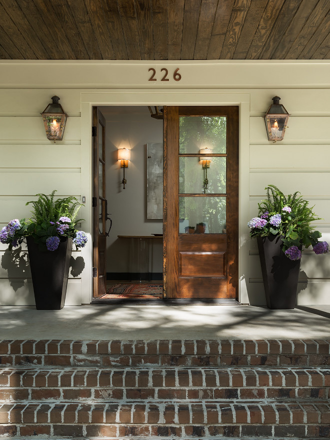 Brick Porch, Plank Siding, Wood Front Door, Planters and Outdoor Lantern Lighting. Brick Porch, Plank Siding, Wood Front Door, Planters and Outdoor Lantern Lighting The exterior brick is full brick; Saint Charles. The planters are from Big Lots. . The front door is from Southern Window Supply in Pelham, AL. The lanterns are from The Coppersmith #BrickPorch #Porch #Plank #Siding#WoodFrontDoor #Door #FrontDoor #Planters #OutdoorLantern #OutdoorLighting Willow Homes