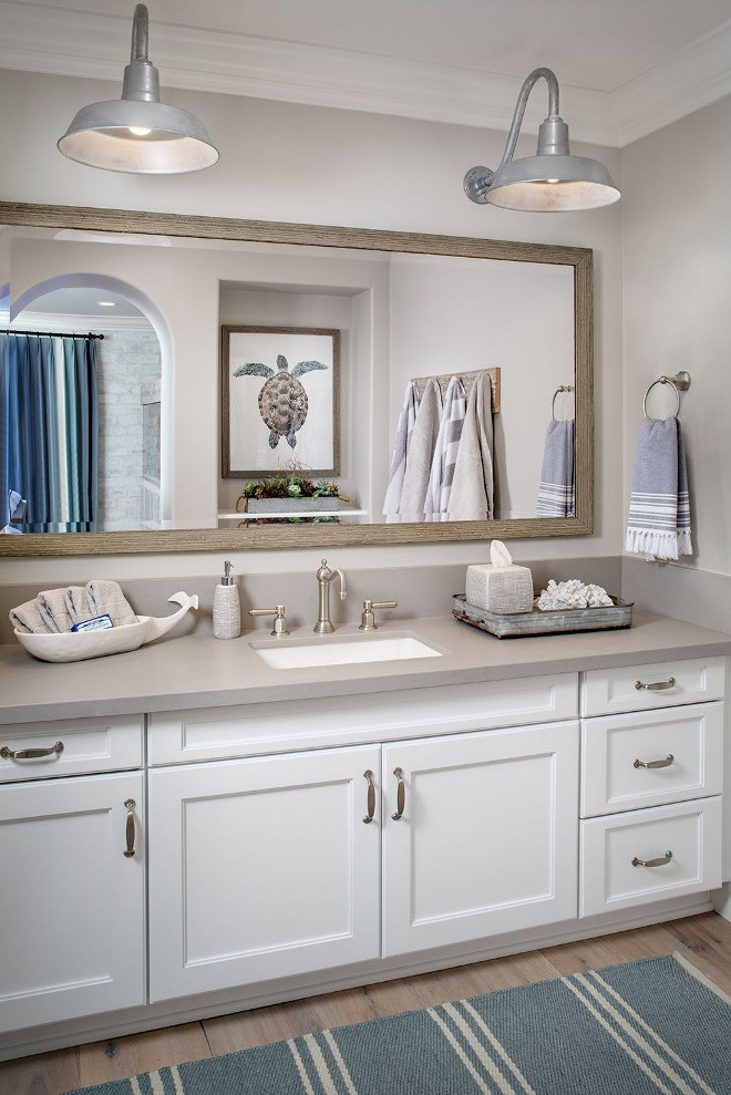 Farmhouse Bathroom with Quartz Countertop. Farmhouse Bathroom with Quartz Countertop Raw Concrete Quartz from Ceasarstone and Barn Lighting. Barn lighting is The Original Warehouse Gooseneck Light from Barn Light Electric​ Co​. #FarmhouseBathroom #Bathroom #QuartzCountertop Tracy Lynn Studio