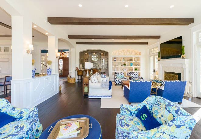 Great room with built-in dividing space from kitchen. A built-in cabinet creates a sense of separation from the kitchen to the great room. Echelon Custom Homes