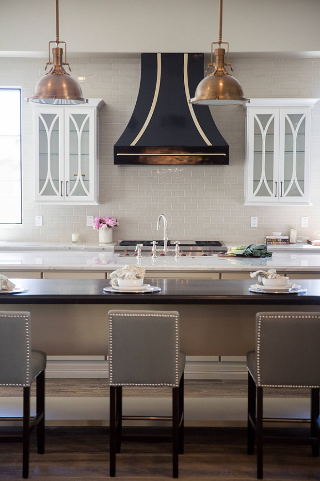 Kitchen. This neutral kitchen features two islands; one with Heirloom Quartzite and other with dark stained butcher's block #Kitchen Luster Custom Homes & Remodeling