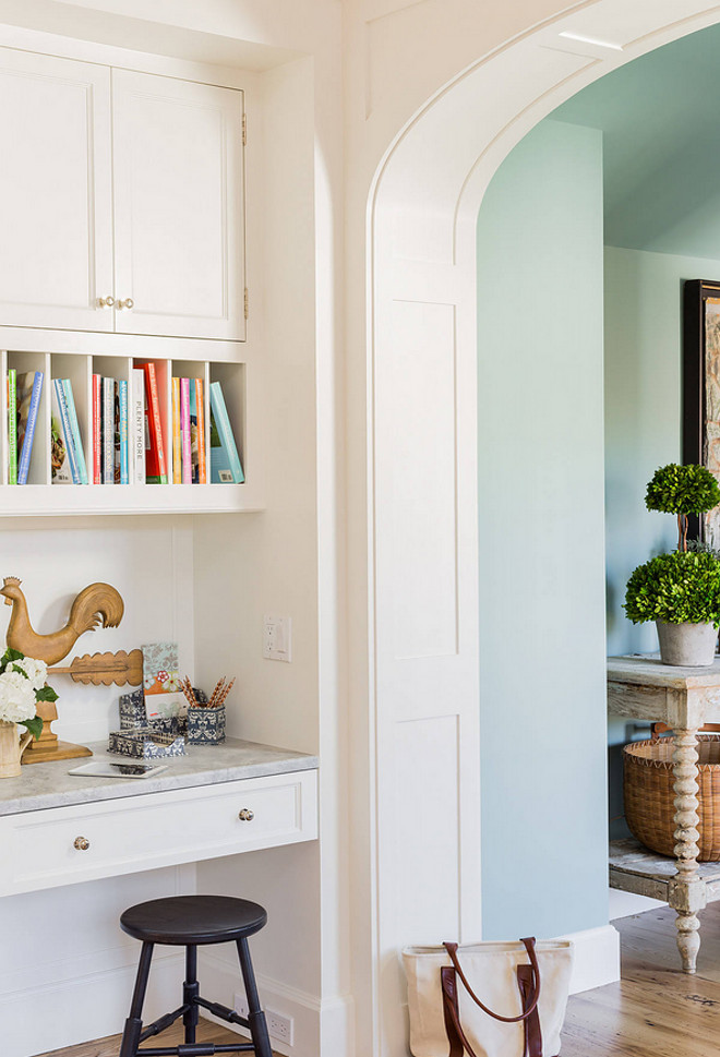 Kitchen Desk- A desk area offers space to pay bills or talk on the phone while cooking meals, with a closed upper cabinet for phone books and cookbooks and additional open slots below to display cookbooks #kitchendesk Nancy Serafini Interior Design