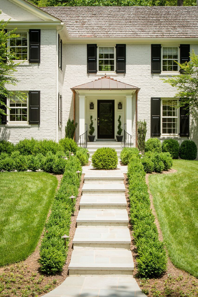 Light Tan Painted Brick Home with Black Shutters and Black Front Door. Home Exterior Light Tan Painted Brick Home with Black Shutters and Black Front Door #LightTanBrickHome #PaintedBrick #PaintedBrickHome #PaintedBrickExterior #TanPaintedBrick #BlackShutters #BlackFrontDoor #FrontDoor Anthony Wilder Design/Build, Inc