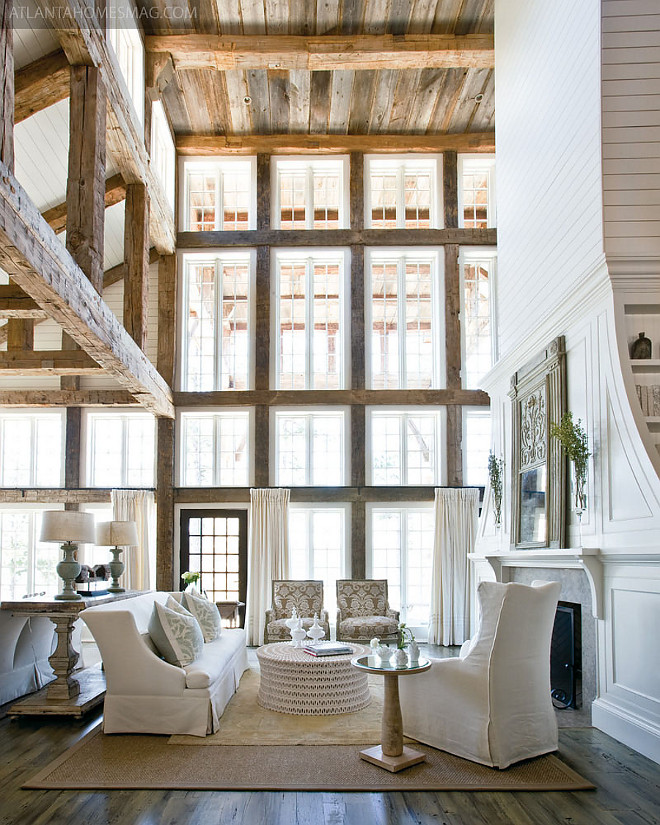 Living room with tall ceiling, rustic barnwood plank ceiling, exposed rustic beams, reclaimed wood trim and shiplap fireplace paneling. Living room with tall ceiling, rustic barnwood ceiling plank, exposed rustic beams, reclaimed wood trim and shiplap fireplace paneling #Livingroom #livingroomtallceiling #rusticbarnwood #rusticceiling #plankwoodceiling #plankceiling #exposedrusticbeams #exposedbeams #rusticbeams #reclaimedwoodtrim #shiplap #shiplapfireplace #paneling Via Atlanta Homes & Lifestyles