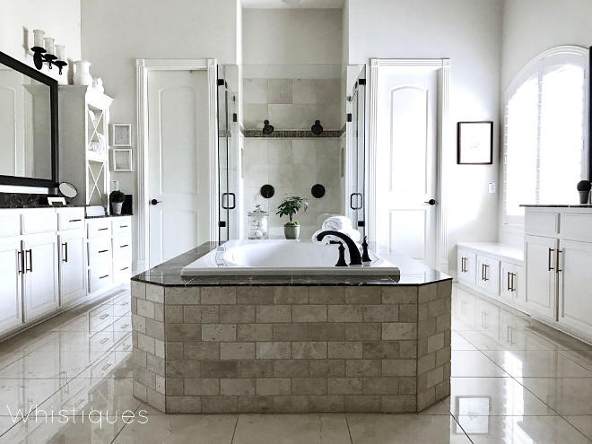 Master Bathroom. Classic Master Bathroom. Tub stone tile is Daltile/Plateau Warm Beige; Daltile/Emperador Dark. Master Bathroom. Master Bathroom #MasterBathroom Beautiful Homes of Instagram @whistiques