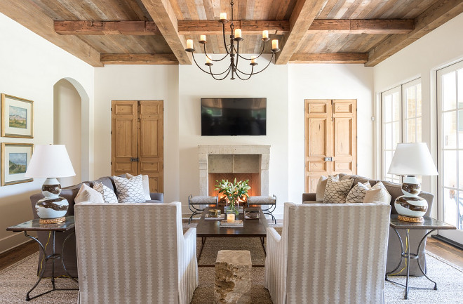 Neutral living room with reclaimed wood ceiling and white oak built in doors. Neutral living room with reclaimed wood ceiling and white oak built in doors. Neutral living room with reclaimed wood ceiling and white oak built in doors #Neutrallivingroom #livingroom #reclaimedwoodceiling #reclaimedwood #woodceiling #whiteoakdoor #oakbuiltin Munger Interiors