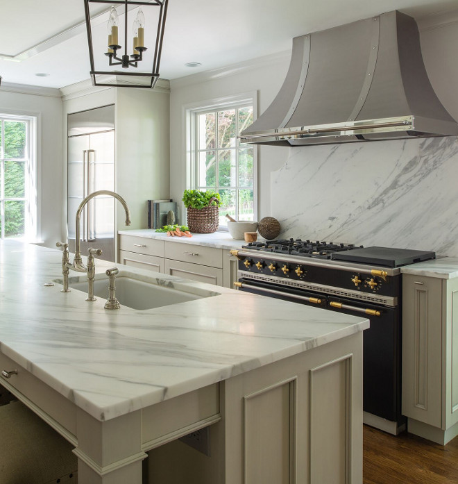 Soft Gray Kitchen Cabinet. Soft Gray Kitchen. Soft Gray Kitchen Cabinet with Calcatta Gold Marble. Hood is Vent-a-Hood. #SoftGrayKitchen #GrayKitchenCabinet #CalcattaGoldMarble Anthony Wilder Design/Build, Inc