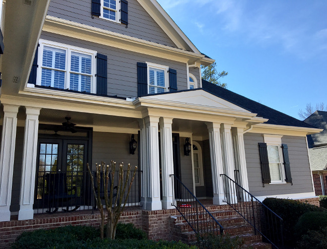 Traditional Grey Exterior Color Scheme. Siding Paint Color Benjamin Moore 1475 Graystone. Trim Paint Color Benjamin Moore OC-17 White Dove, Shutters Paint Color Benjamin Moore CW-680 Mopboard Black. #TraditionalGreyExterior #GreyExterior #ColorScheme #GreyExteriorColorscheme #ExteriorColorscheme #ExteriorColorschemeideas #SidingPaintColor #BenjaminMoore1475Graystone #TrimPaintColor #BenjaminMooreOC17WhiteDove #ShuttersPaintColor #BenjaminMooreCW680MopboardBlack Design by Rebecca Dumas from It All Starts with Color blog