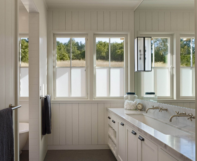 Vertical Shiplap. The vertical shiplap are individual 1x6 boards with an eased edge. Sink is a Century 48" sink. The vanity is 9' long. Bathroom with Vertical Shiplap. White Vertical Shiplap Painted in Benjamin Moore White Dove. Vertical Shiplap #VerticalShiplap #shiplap #whiteshiplap #BenjaminMooreWhiteDove Nick Noyes Architecture