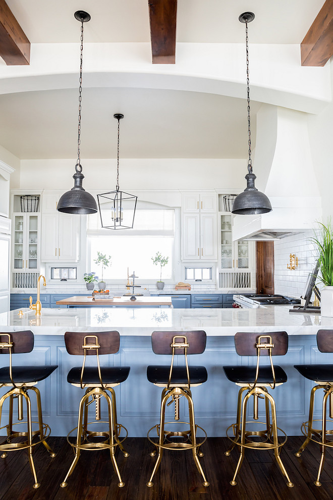 Blue and white kitchen. White upper cabinet paint color is Benjamin Moore Swiss Coffee. Lower blue cabinet paint color is Benjamin Moore Van Courtland Blue #BenjaminMooreSwissCoffee #BenjaminMooreVanCourtlandBlue Becki Owens Becki Owens & Jamie Bellessa