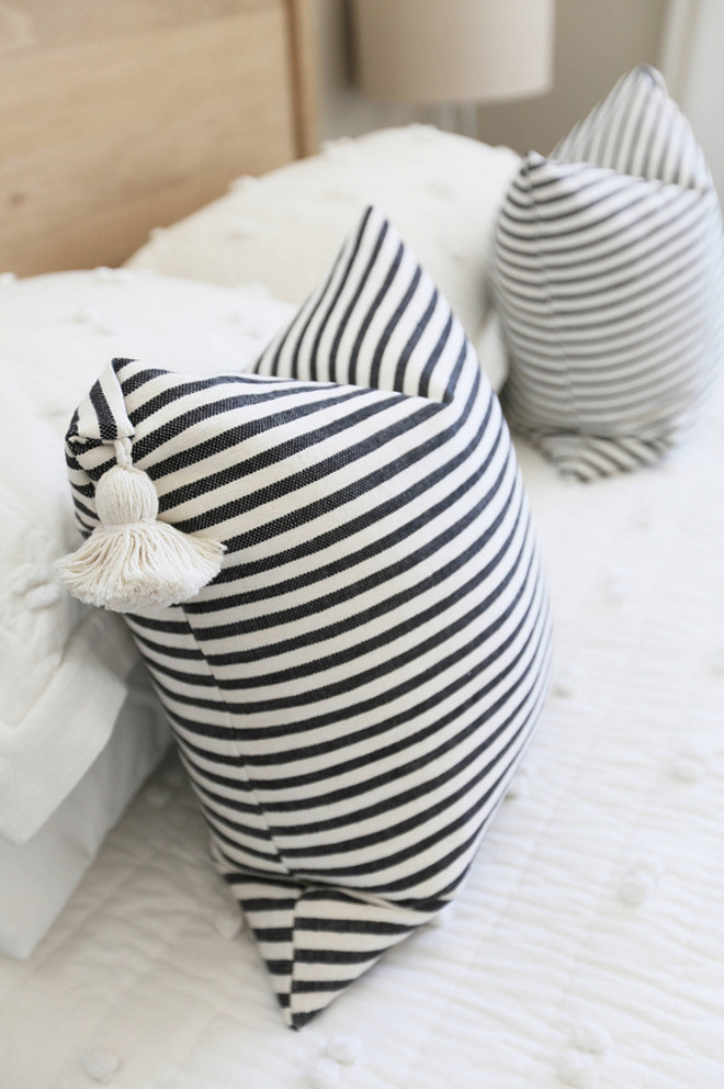 Black and White Stripped Pillow. The master bedroom is all about the texture with pompoms being the defining theme. Black and White Stripped Pillow. Black and White Stripped Pillows. Black and White Stripped Pillow. #BlackandWhiteStrippedPillow JoAnn Regina Home