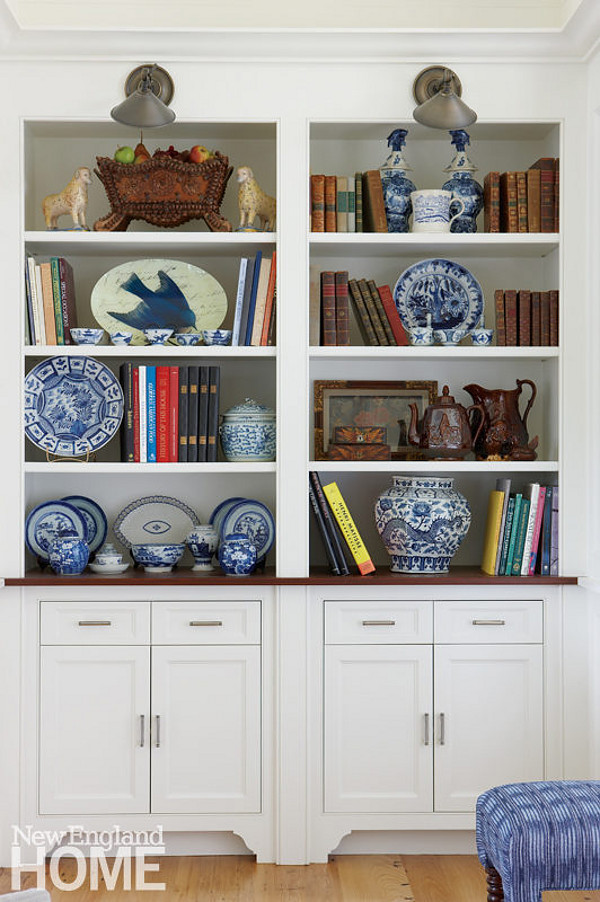 Bookshelf Decorating ideas. The designer displays her favorite antique dishware on the living room’s bookshelves. Cabinet paint color is Benjamin Moore OC-17 White Dove. Bookshelf Decorating ideas. Traditional Bookshelf Decorating ideas. Bookshelf Decorating ideas #BookshelfDecoratingideas #BookshelfDecor Nancy Serafini