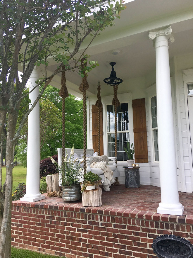 Brick Porch. Traditional Farmhouse with Porch Swing and Brick Porch. Brick Porch. The brick is solid and is made in molds by hand to look like old brick the name is Orleans. Traditional Farmhouse with Porch Swing and Brick Porch #BrickPorch #Brick #porch #TraditionalFarmhouse #TraditionalFarmhouseporch #PorchSwing #Brick #Porch Beautiful Homes of Instagram @cindimc.ivoryhome