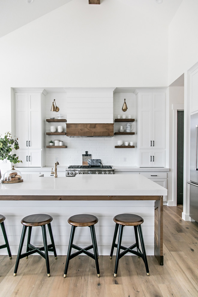 Crisp White Farmhouse Kitchen. Crisp White Farmhouse Kitchen with shiplap hood and brick backsplash. Crisp White Farmhouse Kitchen #CrispWhiteFarmhouseKitchen #WhiteFarmhouseKitchen #FarmhouseKitchen #shiplaphood #brickbacksplash Sita Montgomery Interiors