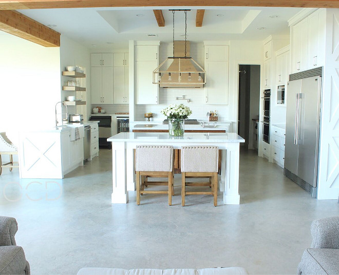 Double Island Kitchen. We absolutely love having two large islands! We do the majority of our meal prep on the inner island and we eat the majority of our meals around the outer island that my husband designed to mimic the look of a table. It also works out really well for parties. Double Island Kitchen Ideas #DoubleIslandKitchen #DoubleIslandKitchenIdeas Beautiful Homes of Instagram @organizecleandecorate