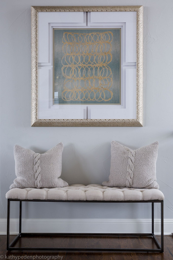 Entry. Entry Decor. Tufted upholstered bench by Classic Home Furnishings and contemporary artwork by Paragon create impact in this entry. Cable knit pillows by Villa Home. #Entry #Entrydecor Restyle Design, LLC.