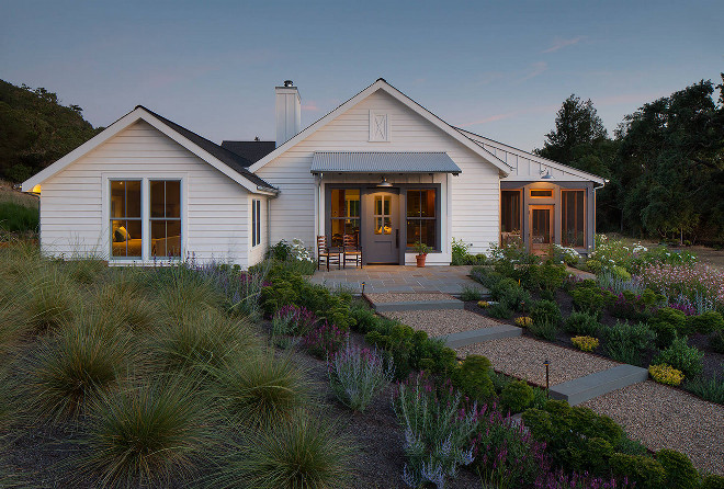 Farmhouse Exterior. View of Entry, master bedroom to left and screen porch to right. #FarmhouseExterior First Bay Architecture