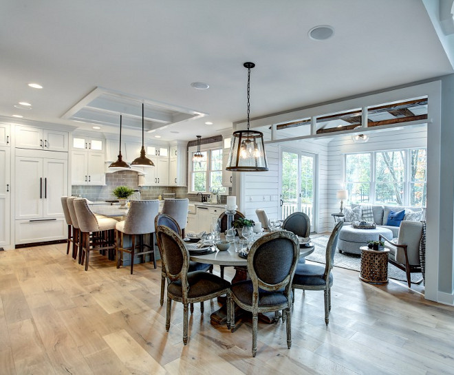 Farmhouse Kitchen opens to family room with shiplap and exposed ceiling beams Fixer Upper Inspired Farmhouse Kitchen opens to family room with shiplap and exposed ceiling beams #FixerUpper #FarmhouseKitchen #openkitchen #familyroom #shiplap #exposedceilingbeams CVI Design