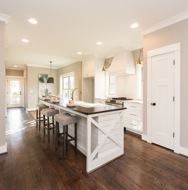 Farmhouse Kitchen. Modern farmhouse kitchen with shiplap island and shiplap hood. What a great layout for narrow kitchens! I love the shiplap island and hood. The custom cabinets are constructed of Birch. Farmhouse kitchen with shiplap island and shiplap hood. #Farmhousekitchen #kitchen #shiplapisland #shiplaphood #kitchenshiplap #shiplap #farmhouseshiplap Willow Homes