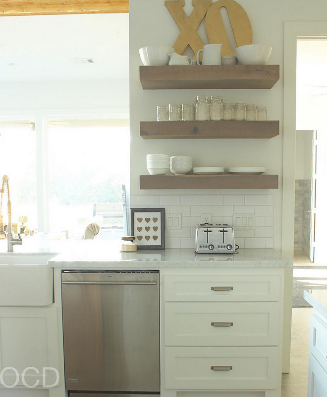 Floating Shelves. Kitchen Floating Shelves. Farmhouse Floating Shelves. The floating shelves are custom made from White Oak with a Classic Grey stain to give it a weathered look. Floating Shelves. Floating Shelves #FloatingShelves #KitchenFloatingShelves #FarmhouseFloatingShelves Beautiful Homes of Instagram @organizecleandecorate