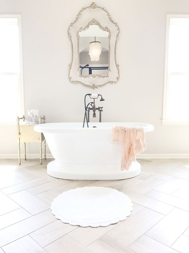 French Bathroom with herringbone floor tile. The French mirror over freestanding tub is from Joss & Main. Crochet rug is from Neiman Marcus. French Bathroom with herringbone floor tile. French Bathroom with herringbone floor tile. French Bathroom with herringbone floor tile. French Bathroom with herringbone floor tile #FrenchBathroom #herringbonefloor #herringbonefloortile Beautiful Homes of Instagram @sugarcolorinteriors