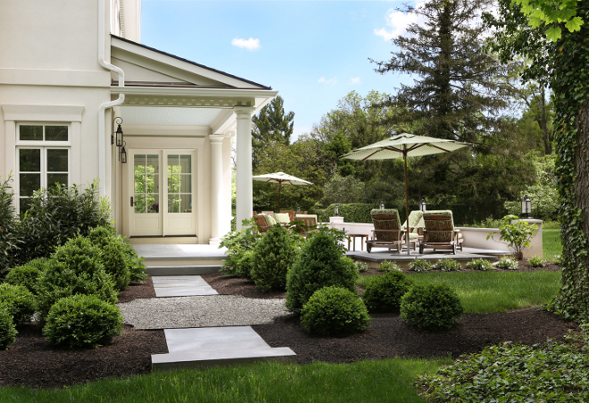 Landscaping. Traditional landscaping. This backyard oasis features a deep covered porch with tuscan columns and beadboard ceilings. #landscaping #traditionallandscaping Knight Architects LLC