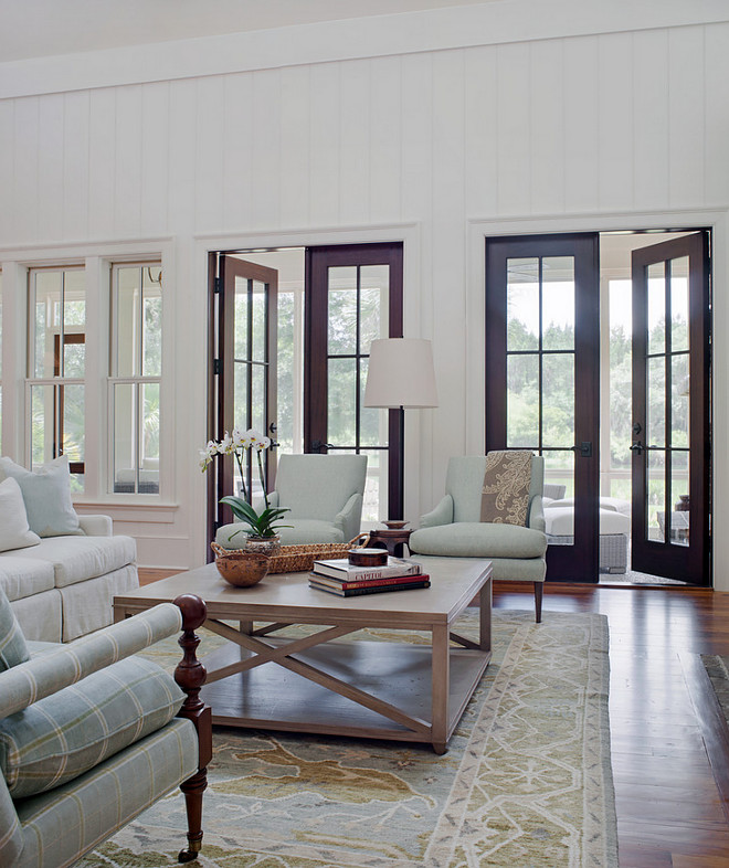 Living room French Doors. Southern-style living room with Mahogany French doors. Living room Mahogany French Doors. Living room French Door Ideas. Living room French Doors #LivingroomFrenchDoors #Livingroom #MahoganyFrenchDoors #Livingroom #FrenchDoorPearce Scott Architects