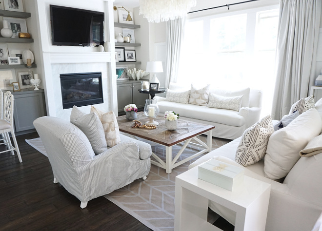 Living room design. Neutral living room with slipcovered furniture and grey cabinets surrounding fireplace. Living room design #Livingroom #Livingroomdesign Beautiful Homes of Instagram @MyHouseOfFour