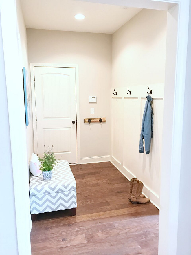 Mudroom. Mudroom: the laundry room is right off the mudroom and makes things very easy for sports days. Our pantry is also off of this room and that is where we keep our second refrigerator for easy access to extra water and drinks for the kids. Mudroom painting is by Lola Donoghue. Our kitchen has a desk area, that we use for homework. Desk area framed art is by Parima Studio #Mudroom Beautiful Homes of Instagram @sugarcolorinteriors