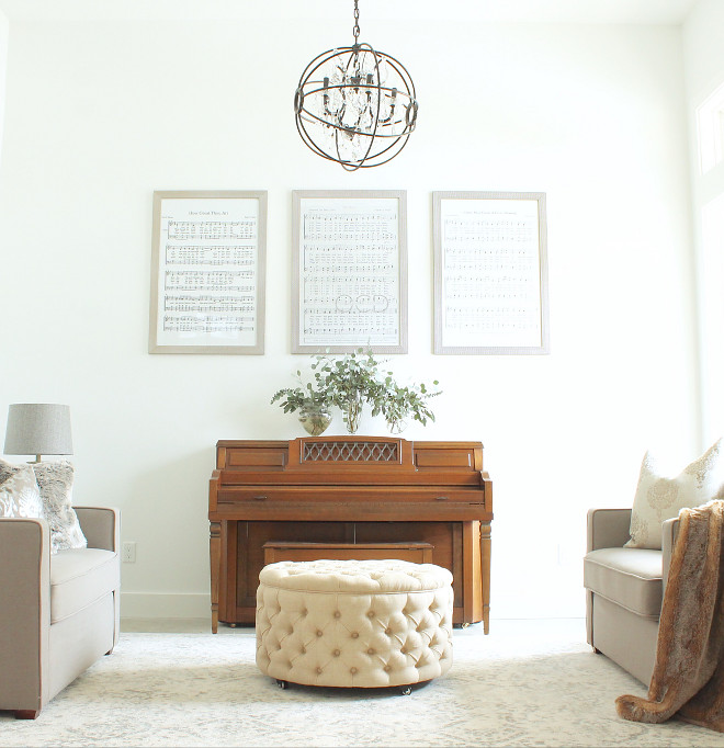 Music Room Design. The piano is made by Everett. The rug is from Rugs USA. The chandelier is the black wrought iron orb chandelier available through overstock. #Musicroom Beautiful Homes of Instagram @organizecleandecorate