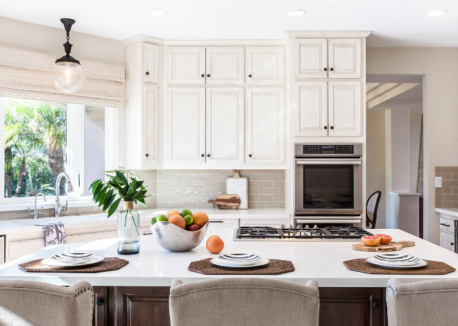 Neutral kitchen cabinets and backsplash. Neutral kitchen with off-white cabinets, white quartz countertop and tan subway tile backsplash. Neutral kitchen cabinets and backsplash ideas. Neutral kitchen cabinets and backsplash #Neutralkitchen #Neutralkitchencabinets #Neutralkitchenbacksplash Laura Abrams Design