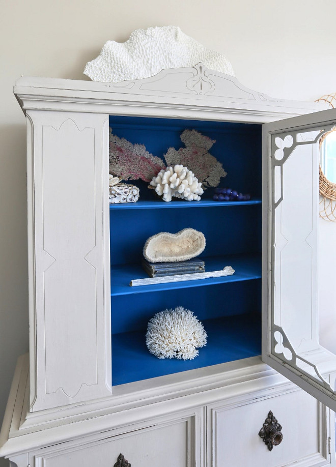 Painted Vintage Cabinet. Vintage cabinet features a French Grey paint color on the outside and a Cobalt Blue on the inside shelves #PaintedVintageCabinet #VintageCabinet #Vintagecabinetpaint #FrenchGrey #paintcolor #CobaltBlue #insideshelves JoAnn Regina Home