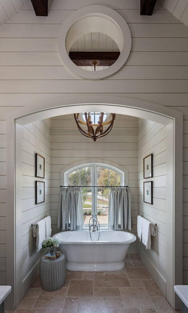 Shiplap Bathroom Nook. Shiplap Bath Nook. Arch Bath nook with shiplap paneling, arched window, exposed beams, orb pendant light and framed art #Arch #bathnook #bathroom #bathroomnook #shiplap #shiplappaneling #archedwindow #exposedbeams #orbpendant #lighting #framedart Wright Design