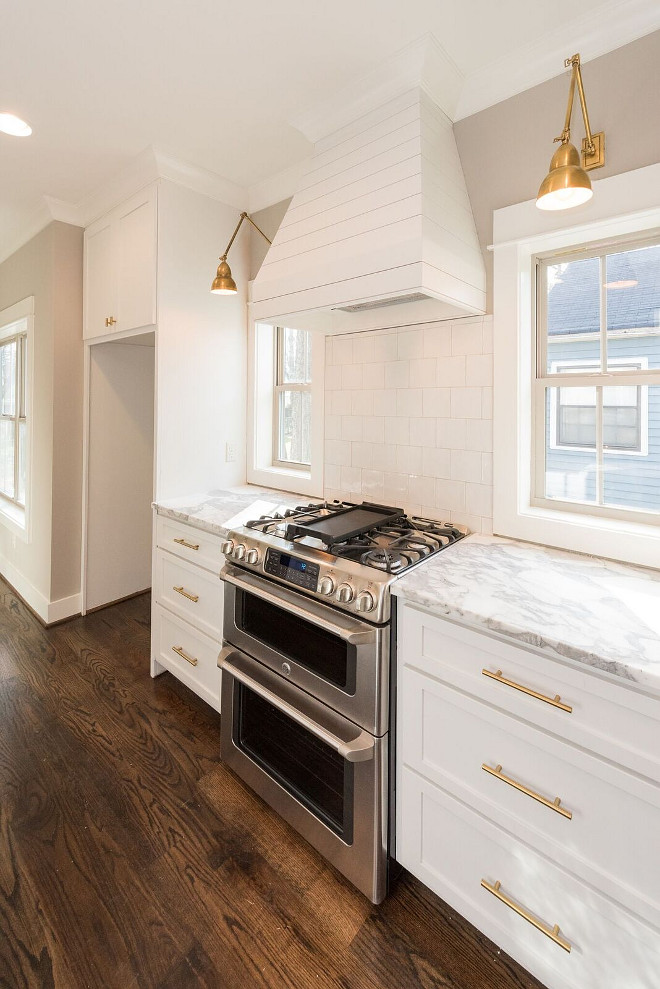 Shiplap Hood. Shiplap Kitchen Hood. Kitchen with Shiplap Hood. Custom Shiplap Hood. Kitchen cabinets and shiplap hood paint color is Benjamin Moore White Dove #ShiplapHood #Shiplap #Kitchen #ShiplapHood #KitchenShiplapHood #CustomShiplapHood #Kitchencabinets #shiplaphoodideas #paintcolor #BenjaminMooreWhiteDove Willow Homes