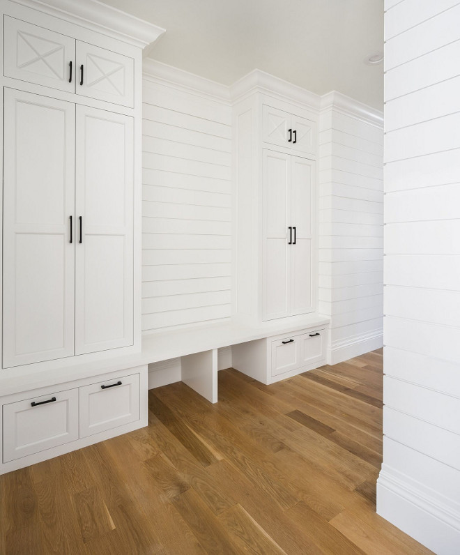 Shiplap Mudroom. Mudroom features shiplap paneling and the same white oak flooring with matte finish. Walls and cabinet paint color is Benjamin Moore OC-117 Simply White. Shiplap Mudroom Ideas. Shiplap Mudroom Cabinet. Shiplap Mudroom Paneling #Shiplap #Mudroom Fox Group Construction