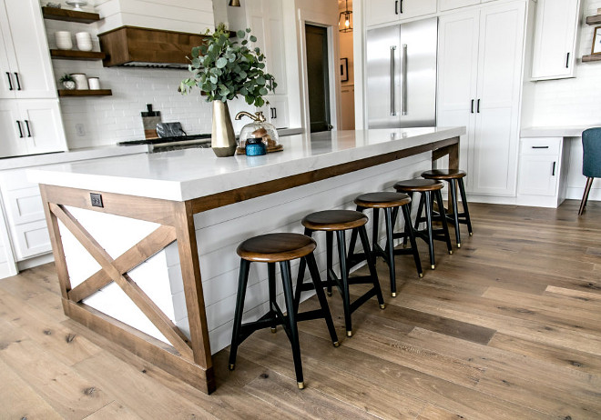 Two-toned Island. Two-toned Kitchen Island. The design of the kitchen centered around my desire to have a two toned island. I designed the island to have a center base, with shiplap detail. I wanted that section of the island to be painted white. It was important to me to add some stained wood into the design of the kitchen to add warmth. One way I did this was to accent the island with stained “X” end panels. #TwotonedIsland #TwotonedKitchenIsland #KitchenIsland #XKitchenIsland Sita Montgomery Interiors