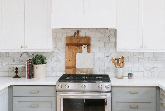 Two toned White and grey kitchen. Two toned kitchen with white upper cabinets and grey lower cabinets. Two toned White and grey kitchen. Two toned kitchen with white upper cabinets and grey lower cabinets and brass hardware #Twotonedkitchen #towtonedWhiteandgreykitchen #Whiteandgreykitchen #whiteuppercabinets #greylowercabinets Studio McGee