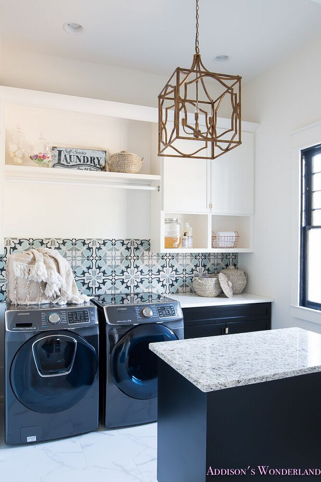 Two toned laundry room. Laundry room features white upper cabinets painted in Sherwin Williams Alabaster. Black lower cabinets are Sherwin Williams Inkwell #Twotonedlaundryroom #Twotonedcabinet #Laundryroom #whiteuppercabinets #SherwinWilliamsAlabaster #blackcabinets #SherwinWilliamsInkwell Home Bunch's Beautiful Homes of Instagram @addisonswonderland