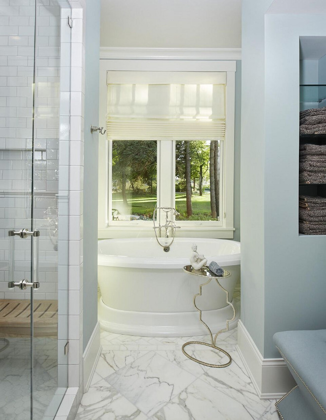 Bathroom with blue gray walls and Carrara marble floor tile. Flooring is honed Calacatta tile. Bathroom with blue gray walls and Carrara marble floor tile. Bathroom with blue gray walls and Carrara marble floor tile #Bathroom #bluegraywalls #Carraramarble #floortile Benchmark Wood & Design Studios - Mike Schaap Builders