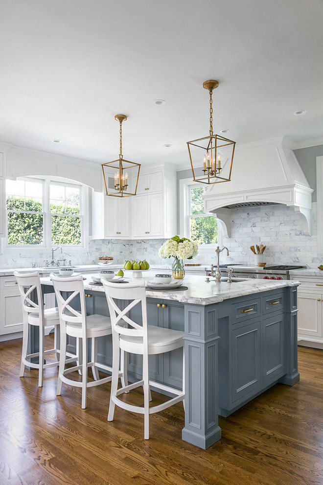 White Kitchen with Stacked Cabinets and Grey Island - Home Bunch