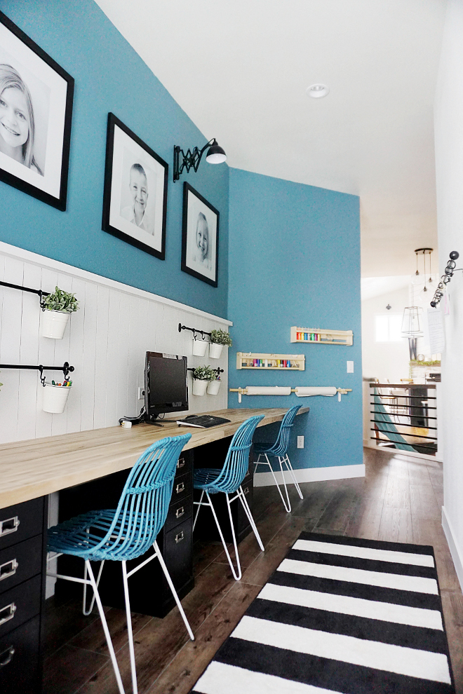 Computer Station. Farmhouse Kids Computer Station with butchers block countertop. We decided to add a pop of color - a custom blue/green slate color. We knew we also wanted to add a wall treatment to break up the wall since the wall is so long and tall! We decided on a thin vertical shiplap with a ledge on top. We also knew we wanted to add large pictures of our children to the space so these 24"x24" picture frames were perfect! Computer Station #ComputerStation #kidsComputerStation #butchersblock #farmhouseComputerStation #farmhouse Home Bunch's Beautiful Homes of Instagram @household no.6