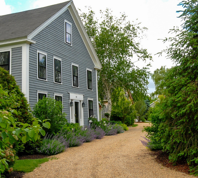 Country Farmhouse. Country farmhouse Driveway. Peastone driveway with evergreen screening and mixed planting #CountryFarmhouse #Countryhome # farmhouse #Driveway #Peastonedriveway a Blade of Grass